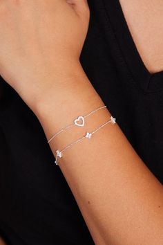 Show your love with the Sterling Silver Heart Bracelet, a beautifully crafted, minimalist piece that exudes elegance and charm. Perfect as a gift for her, whether it's for a girlfriend, a close friend, or a loved one, this bracelet features a delicate heart charm that symbolizes affection and connection. Its sleek sterling silver chain and dainty flower accents make it an ideal accessory for everyday wear or special occasions. This bracelet is the perfect balance of subtlety and sophistication, making it a meaningful gift that will be cherished for years to come. Finding the perfect fit is a breeze! Our bracelets are designed to be adjustable approx. 1 inches, so everyone can feel comfy and confident. For example: if you order 6 inches, you will be able to use your braceelt up to 7 inches. Dainty Heart Bracelet For Valentine's Day, Delicate Adjustable Bracelets For Valentine's Day, Delicate Adjustable Bracelet For Valentine's Day, Adjustable Delicate Heart Charm Bracelet, Dainty Heart Charm Jewelry For Friendship, Everyday Heart Bracelet For Valentine's Day, Delicate Rose Gold Bracelet With Heart Charm, Minimalist Heart Charm Bracelet For Valentine's Day, Silver Minimalist Heart Bracelet For Valentine's Day