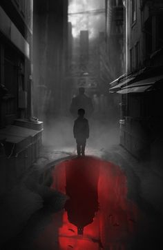 a man standing in the middle of an alley way with a red light on it