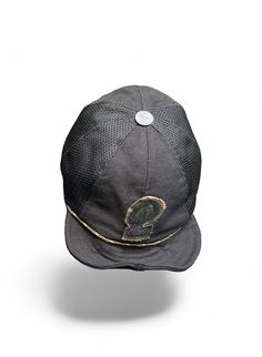 The Makshy black canvas baseball hat effortlessly blends classic style with individualistic flair. Its form-fitting design and comfortable fabric ensure a polished look, while the customisable letter motif and antique-style metal squatchee add a touch of vintage charm. This fashion-forward cap offers versatility with its adjustable and rollable visor, perfect for adapting to different styling preferences. Crafted for convenience, its foldable design makes it ideal for on-the-go wear and easy packing during travels. Metal eyelets enhance breathability, ensuring comfort in any weather. FEATURES * Black cotton canvas cap with nylon mesh  * Foldable eight-panel unisex design * Adjustable and rollable visor with built-in wire * Customisable camouflage fabric contoured black velcro letter emblem Black Breathable Short Brim Hat, Black Urban Flat Cap, Urban Black Flat Cap, Black Breathable Flat Cap, Black Fitted Baseball Cap With Short Brim, Black Breathable 5-panel Hat, Functional Black Six-panel Hat, Fitted Black Baseball Cap For Outdoor, Black Six-panel Fitted Hat, One Size Fits Most