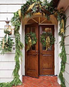 an instagram photo with christmas wreaths on the front door