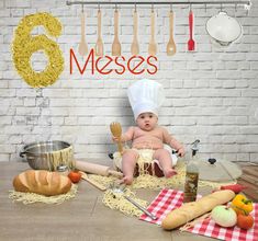 a baby is sitting on the floor in front of some food and utensils