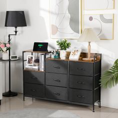 a living room with white walls and black furniture