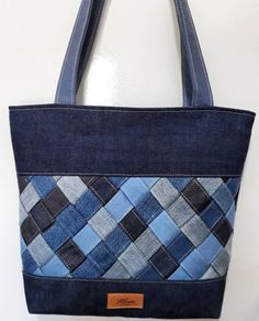 a blue and black bag hanging on the wall