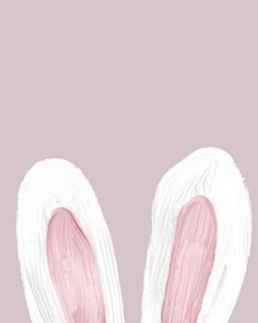 two pink and white bunny ears are shown in front of a light purple background with the word