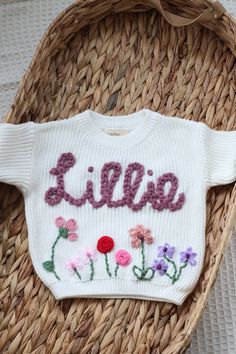 🤍 The perfect personalised sweater for your little love or a fantastic personalised gift  🤍 100% handmade designs with care and attention put into every sweater. Choose personalised wording or name with the optional addition of a floral meadow. 🤍 Colours may vary slightly due to screen settings and lighting. 🤍 Care Instructions - Turn the sweater inside out and Machine Wash or Hand Wash. Air Dry Naturally. Shipping  *Please note that there is a two-week lead time for personalised orders - if Personalized Pink Crew Neck Sweater, Personalized White Cotton Sweater, Customizable Cute Crew Neck Sweater, Cute Customizable Crew Neck Sweater, White Cotton Sweater With Name Print, Personalized Cute Crew Neck Sweater, Handmade White Cotton Sweater, White Letter Print Sweater As Gift, Baby Jumpers