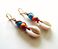 Wire Wrapped Cowrie Shell Dangle Earrings Boho Chic Earrings Beach Beaded Metal Earrings, Bohemian Cowrie Shell Earrings As Gift, Bohemian Cowrie Shell Earrings For Gift, Metal Beaded Earrings For Beach, Handmade Metal Beaded Earrings For Beach, Beach Wire Wrapped Beaded Drop Earrings, Bohemian Shell Earrings For Jewelry Making, Bohemian Wire Wrapped Earrings For Beach, Bohemian Hand Wrapped Metal Earrings