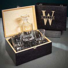 two glasses and a decanter in a wooden box with the initials william written on it