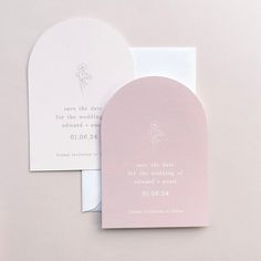 the wedding stationery is laid out on top of each other, and it's pink