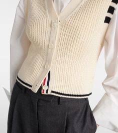 Find THOM BROWNE Striped Wool Sweater Vest on Editorialist. Material: 100% wool. Care instructions: dry clean. Made in the UK. Closure: buttoned front. Designer Wool V-neck Outerwear, Cream Merino Wool Outerwear For Work, Merino Wool Cream Outerwear For Work, White Wool V-neck Outerwear, Wool Cable Knit Outerwear For Work, Designer Beige Wool Sweater, White Sweater Vest For Winter Workwear, Cream Wool V-neck Outerwear, Tailored Wool Cardigan For Winter