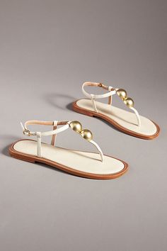 Leather upper, insole, sole Buckle styling Imported | T-Strap Thong Sandals by Vicenza in Beige, Women's, Size: 37, Leather at Anthropologie Elegant Adjustable T-strap Sandals With Single Toe Strap, Elegant Adjustable T-strap Sandals, Elegant T-strap Toe Post Sandals For Vacation, Elegant T-strap Sandals For Vacation, Elegant Adjustable T-strap Toe Post Sandals, Elegant Adjustable T-strap Sandals With Toe Post, Thong Sandals, T Strap, Leather Upper