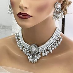 Bridal Set, Pearl Choker Necklace Earrings, Indian Bridal Jewelry Set, Kundan Jewelry, Victorian Pearl Choker statement, Bollywood Jewelry, evening jewelry set Gorgeous Glowing and sparkling luxury Bollywood-inspired jewelry set with studded diamonds and colorful stones, adding a royal touch to complete your look for your special occasion! It would be the perfect jewelry set for you chic brides and your bridesmaids, or any contemporary trendsetter looking for those traditional vibes, but still w White Jewelry Sets For Wedding, White Pearl Chain Bridal Necklace, White Bridal Necklace With Matching Earrings For Party, White Dangle Bridal Necklace For Party, White Jewelry Sets With Matching Earrings For Wedding, White Pearl Jewelry For Celebration, White Necklace With Matching Earrings For Wedding, White Wedding Jewelry Sets With Matching Earrings, White Dangle Bridal Necklace For Wedding