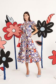 LYNN DRESS – CELIA B Playful Flutter Sleeve Spring Dress, Playful Spring Dress With Flutter Sleeves, Summer Midi Dress With Ruffles, Playful Floral Print Dress For Vacation, Printed Short Sleeve Midi Dress For Spring, Playful Floral Print Vacation Dresses, Patterned Printed Dress For Garden Party, Playful Summer Dress With Flutter Sleeves, Multicolor Flutter Sleeve Dresses For Spring