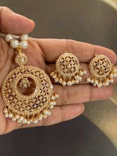 Featuring a traditionally designed pearl pendant set in 925 sterling silver & 22k gold plating. It has been set with freshwater pearls. These evergreen designs never go out of style. Its made by Our expert Amritsari Artisans Made In India / Amritsar-Punjabi Style Jadau Sets Option 1 ) Pearl Design SILVER Weight : 40.650 GMs Pendant Dimensions: 3 x 2 inches Earrings Dimensions: 2 x 1 inches Price: Amritsari Jadau Jewellery, 22k Gold Pearl Necklace For Celebrations And Festivals, Traditional Gold Plated Kundan Pendant Necklace, Traditional Gold-plated Kundan Pendant Necklace, Pearl Pendant Necklace As Diwali Gift, Pearl Pendant Necklace For Diwali Gift, Diwali Gift Necklace With Pearl Pendant, Diwali Pearl Necklace With Pearl Drop, Elegant Meenakari Round Pendant Jewelry