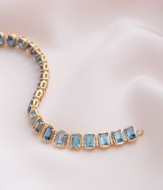 New Arrivals, just in time for the holidays ❄️ The Emerald Cut London Blue Topaz & Diamond Bracelet #JamieWolf Gold Topaz Jewelry With Emerald Cut, Emerald Cut Topaz Gold Jewelry, Emerald Cut Blue Topaz Jewelry With Gemstone Accents, Blue Jubilee Gold Bracelet In Fine Jewelry Style, Luxury Blue Gold Jubilee Bracelet, London Blue Topaz Bracelet, Luxury Blue Topaz Gemstone Bracelet, Tennis Bracelet Diamond, London Blue Topaz