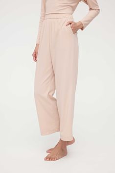 These Cotton Cozy Lounge Pants are an understated sleep style with a loose fit that make them extra comfy to toss, turn, and snooze in. Tailored in a luxuriously soft blend of cotton and TENCEL™ Modal. Details Materials & Care Shipping & Returns • Features an elastic waistband, pockets, cropped legs that fall just above the ankle, and a relaxed yet feminine fit. • Complete the set: this top pairs perfectly with our Cotton Cozy Long Sleeve Shirt. Size M is 37.0" in length.• Made from a premium bl Wide-leg Loungewear Bottoms With Elastic Cuffs, Sleepwear With Pockets For Loungewear, Casual Relaxed Fit Sleep Pants, Comfy Relaxed Fit Pants For Relaxation, Relaxed Fit Pants With Pockets For Pajama Party, Relaxed Fit Pants For Relaxation, Comfortable Sleepwear With Pockets, Casual Wide-leg Sleep Pants, Relaxed Fit Straight Leg Sleep Pants