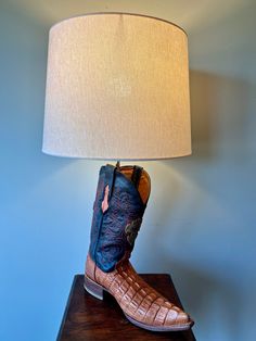 This boot was made for lighting!!  This lamp was inspired by my daughter who lives in Texas. She has the original lamp and we loved it so much...so here it is!! This is the LEFT boot!  This boot is all leather and stands 25" tall and 14" wide which is the width of the beautiful soft cream color chenille like shade. The boot is approx. 13" long and 5" wide. This lamp is wired with a heat resistant Bakelite socket that can take any watt bulb. Wichita Ks, Cowboy Boot, Live Light, Table Lamps, My Daughter, Heat Resistant, Cowboy Boots, Cream Color, Lamp Light