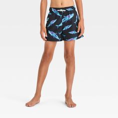 Add a fun and fearsome sea life print to their swimwear with this Shark Printed Swim Shorts from art class™. These lightweight swim trunks are designed with a built-in boxer brief for comfort and extra coverage both in and out of the water. Featuring a blue and purple shark pattern on a black backdrop, these mid-rise swim trunks are fun to pair with a variety of rash guards, tees or tanks for versatile swimwear options. The full elastic waistband with an adjustable drawstring lends them a secure and customizable fit. Plus, the UPF 50+ finish helps protect against UV rays. Welcome to art class™, where style is what you make it. Playful Swim Trunks With Built-in Shorts, Playful Blue Swimwear With Built-in Shorts, Playful Swimwear With Built-in Shorts For Beach Season, Playful Surfing Shorts For Beach Season, Playful Shorts For Surfing And Beach Season, Playful Swim Trunks For Beach Season, Playful Bottoms For Surfing At Beach Season, Playful Bottoms For Surfing Beach Season, Playful Bottoms For Surfing And Beach Season