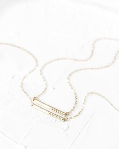 "This bar necklace is a classic, easy to gift piece. From the chain to the pendant, this style is made with 14k gold filled or sterling silver pieces, meaning it is built to last. Personalize this necklace with the names, dates, and special words that mean the most to you! 𝗘𝗮𝘀𝘆 𝗧𝗼 𝗦𝘁𝘆𝗹𝗲, 𝗠𝗮𝗱𝗲 𝗧𝗼 𝗟𝗮𝘀𝘁 Our dainty bar necklaces make for the perfect everyday piece, personalized with your most special sentiments, moments, and memories! Created to last a lifetime, these necklaces Everyday Gold Nameplate Charm Necklaces, Everyday Gold Nameplate Charm Necklace, Everyday 14k Gold Bar Necklace With Adjustable Chain, Minimalist Everyday Nameplate Charm Necklace, Everyday Gold Charm Necklaces 16 Inch, Everyday Gold Charm Necklace 16 Inch, 16 Inch Minimalist Charm Necklace For Everyday, Everyday 14k Gold Bar Necklace With Delicate Chain, Gold Rectangular Pendant Name Necklace For Everyday