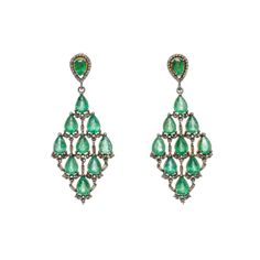 Elegant diamond work is set with rich, green emeralds.