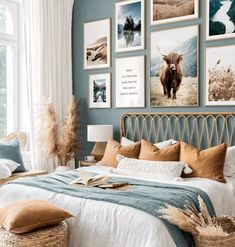 a bed room with a neatly made bed and lots of pictures on the wall above it