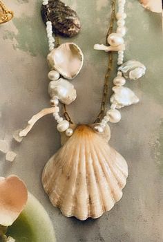 Bohemian Shell With Pearl Charm, Bohemian Strand Jewelry With Pearl Charm, Shell-shaped Pearl Pendant Jewelry For Beach, Beach Jewelry With Pearl Pendant In Shell Shape, Ocean-inspired Shell With Pearl Charm For Beach, Elegant Beach Pearl Shell Pendant, Bohemian Beach Jewelry With Pearl Chain, Elegant Pearl Pendant Shell For Beach, Beach Shell Shaped Pearl Pendant Jewelry