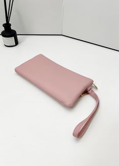 Elevate your accessory game with our Leslie Vegan Leather Triple Zipper Wrist Wallet Clutch. This stylish and versatile purse is designed to keep your essentials organized and easily accessible, featuring a unique triple zipper design that offers multiple compartments for your convenience. Crafted with a high-quality metal zipper, this wallet clutch ensures durability and smooth operation, providing secure storage for your items. Its sleek and lightweight design makes it perfect for on-the-go us Everyday Handheld Coin Purse With Zipper, Handheld Coin Purse With Zipper Closure, Daily Use Clutch Wristlet With Zipper Closure, Pink Wristlet With Zipper Closure For Daily Use, Pink Wristlet With Zipper For Daily Use, Daily Use Coin Purse With Zipper Closure, Versatile Clutch Wristlet With Zipper Closure, Versatile Wristlet Clutch With Zipper Closure, Pouch Wristlet With Zipper For Daily Use