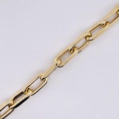 This fantastic 6 millimeter (mm) wide paperclip medium link chain was made for us in Italy with recycled 14 karat gold and finished beautifully to the high standards Italian jewelry is known for! This wonderful statement chain is made affordable by the lightweight design of the links. Metal Quality: 14 karat yellow goldComplete Weight: 4.0 gramsBracelet Type: Chain BraceletChain Type: Lightweight Paperclip LinkMeasurements: 7.5 inches long, 6 mm wide (each link 12.3 mm long)Clasp: Oval ellipse l Luxury Gold-tone Oval Link Paperclip Bracelet, Luxury Yellow Gold Bracelet With Clasp, Timeless Link Chain Bracelet With Paperclip Chain, Yellow Gold Paperclip Cable Chain Bracelet, Gold Paperclip Chain Bracelet For Formal Occasions, Gold Bracelet With Paperclip Chain For Formal Occasions, Timeless Paperclip Chain Bracelet With Rectangular Links, Timeless Chain Bracelet With Rectangular Paperclip Links, Timeless Gold Paperclip Chain Link Bracelet