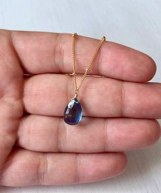 London Blue Topaz Necklace, December Birthstone, Navy Blue Teardrop Pendant, Silver Satellite Chain, Blue Layering Jewelry, Gift for her This simple dainty necklace features a london blue topaz teardrop suspended from a beautiful ball satellite chain in either gold filled or sterling silver. This blue topaz is very deep in color, navy royal blue which makes it match multiple outfit and could be your every day necklace since it is so neutral. This necklace is simply perfect for everyday wear and Blue Topaz Drop Necklaces, Blue Drop Necklaces With Blue Topaz, Blue Pear-shaped Birthstone Jewelry, Faceted Blue Topaz Blue Necklace, Blue Drop Necklace For Gift, Blue Drop Necklaces For Gifts, Blue Topaz Pear-shaped Necklace, Blue Pear-shaped Blue Topaz Necklace, Blue Topaz Briolette Necklaces