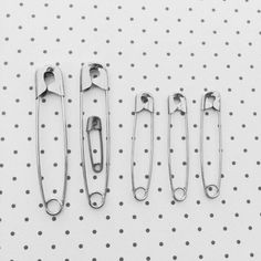 four pairs of scissors sitting next to each other