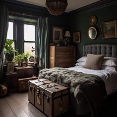 a bedroom with a bed, suitcases and plants in the window sill next to it