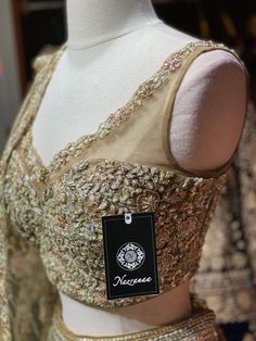 Golden tan intricate with fully rose gold sequence thread embroidery, cut dana, silver & gold zari beautified with crystal stone work lehenga paired with similarly embroidered blouse and net dupatta. This Shimmery Lehengas Which Are To Die For! Fabric:Net Size:38 Ready to Ship! Stone Work Lehenga, Stone Work Blouse, Work Lehenga, Golden Tan, Net Dupatta, Thread Embroidery, Stone Work, Crystal Stone, Work Blouse