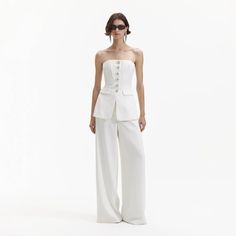 Considered minimalism meets party-ready flair in this jumpsuit, cut from crepe for its satisfying drape. Its waist-cinching bodice is studded with diamanté buttons above flowing trousers. Fitted style, take one size up if between sizes This style has minimal stretch Top and trousers detachable Invisible zip closure at Micro Wedding Decor, Weekend Fits, Rehearsal Dinner Looks, Dinner Looks, Bandeau Jumpsuit, Welcome Dinner, White Bandeau, Crepe Jumpsuit, Bias Cut Skirt