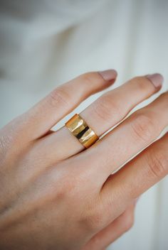 This wide gold band is minimalist, without lacking in substance, and is beautifully hand-crafted to last a lifetime. Each ring is made by Hannah herself and is shined to perfection for the perfect , lightly faceted shine. You can choose a more matte finish or a more heavily hammered finish at checkout. These rings are perfect for all a bride or groom! This ring is made out of SOLID 14k gold. They are lightweight and comfortable for everyday wear, which makes them amazing wedding bands. Choose BR Wide Gold Band, Stamped Rings, Wide Band Ring, Flat Back Earrings, Solid Gold Earrings, Travel Jewelry Case, Wide Rings, Alternative Engagement Rings, Wide Band Rings