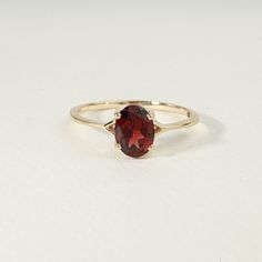 Red Garnet engagement solitaire ring, Oval cut Garnet  ring, 925 Sterling Solitaire Garnet ring, Anniversary ring/Promise ring, Gift for her Available in Sterling Silver, yellow gold plating and 14k Solid Gold  Same design can be made also with other custom gemstones and metal as per request. Product details:  Stone - Garnet Size - 6x8mm  Metal - Sterling Silver / Solid Gold Ring size - Please select your size at the drop down menu. Service Available - Customization Available with any other stones or any ideas! - FREE Worldwide Shipping, with a Tracking Number. - Custom Made To All Sizes - 2 years Warranty for any repair ( Stone replacement not included ) Free Exchange It is vital for us that you are totally happy with your purchase. If you are not 100% happy with your purchase, you can ex Garnet Ring Oval, Red Gold Engagement Ring, Oval Garnet Ring, Red Rings Engagement, Oval Stone Ring Design, Garnet Engagement Rings, Ring With Red Stone, Garnet Gold Ring, Garnet Ring Gold