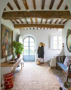 a living room with an arched doorway and white walls