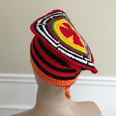 These African traditional hats is part of the Cameroonian national Outfit. For example, These kind of hat is worn by the Cameroonian team at the opening ceremonies of the Olympics ( see pic 4) Description: - Hand woven crochet hat - Unisex - Pom pom on the back - 100% cotton - Origin: Cameroon As seen in picture 3, design at the top of the hat will differ from one hat to another.At the bottom, some hats are red/black and other are white/blackSize: These hats should fit most. Threads stretch to f Traditional Red Brimmed Hat, Traditional Brimmed Red Hat, Traditional Red Hat One Size Fits Most, Traditional Red Headwrap, Adjustable Traditional Headwrap, Traditional Handmade Crochet Cap, Traditional Handmade Crochet Cap Hat, Handmade Traditional Crochet Cap, Handmade Adjustable Traditional Crochet Hat