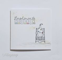 a card with a cat sitting in a chair on it's side and the words heureux written below