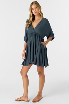 Essential woven mini dress that has a dolman sleeve design, lightweight fabric feel and solid color wash. O'Neill Women's woven mini dress 32.5" In length Dolman sleeve On seam pockets Back neck tie Solid color wash 100% Viscose Crinkle | O'Neill Women's Rosemary Solid Short Sleeve Dress in Slate, Size XS, Viscose Summer Dress With Sleeves, Summer Dresses With Sleeves, Gauze Dress, Dresses Xxl, Junior Outfits, Mini Shift Dress, Short Sleeve Dress, Elbow Length Sleeve, Mini Dress With Sleeves