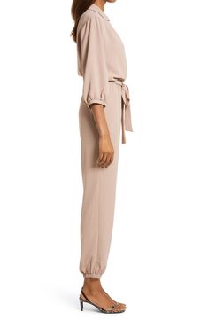 The jumpsuit trend is, well, hopping, and this option, styled with an easy tied waist and elastic cuffs, is a winning way to wear the look. Style Name:Fraiche By J Tie Waist Long Sleeve Jumpsuit. Style Number: 6177668. Champagne Jumpsuit, Beige Jumpsuit, Jumpsuit Style, Long Sleeve Jumpsuit, Tie Belt, Tapered Legs, Jumpsuit, Nordstrom, Size Medium