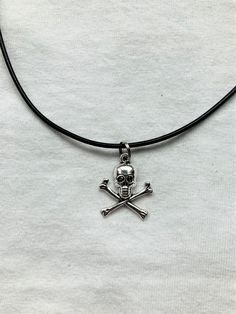 Skull and Bones pendent with a leather cord style necklace. The necklace is 12 and a half inches long but has a 2 inch extender at the end so you can adjust the size. Any questions don't hesitate to drop me a message. Rock Pendant Necklace, Rocker Rings, Skull Choker, Necklace Pendent, Rock Tattoo, Mode Rock, Silver Coin Necklace, Gothic Chokers, Emo Goth