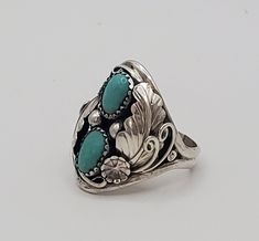 Fancy turquoise sterling silver statement ring.  This amazing ring is crafted in the dome style and is a multi-stone ring featuring stunning detail in the silver work.  This ring has gorgeous 925 sterling silver leaf design and two beautiful cabs of turquoise as its crowning jewel.  This statement piece would make a great gift for dad for a birthday, Valentines Day gift, anniversary or a great graduation or birthday gift!    I only have  few of these rings left, so PLEASE check with me on sizing Silver Handmade Jewelry, Great Gifts For Dad, Rings Silver, Statement Ring Silver, Leaf Ring, Handmade Jewelry Gift, Silver Work, Large Ring, Wife Gift