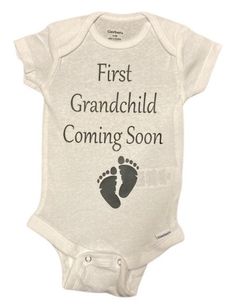 First Grandchild Coming Soon baby one piece bodysuit Onesies® is a perfect  Baby announcement gift or pregnancy announcement!   Nothing matters more than a baby's comfort, and this one-piece bodysuit is the right choice for all active babies. The envelope neckline and three snap leg closure ensure comfort throughout the day.   These gender neutral Gerber brand Onesies® are incredibly comfy! Both the bodysuits and t-shirts are printed on 100% cotton for a super soft feel. These unisex baby bodysu Casual Personalized White Onesie, Casual White Personalized Onesie, Personalized Cotton Onesie For Gender Reveal, White Onesie With Letter Print For Gender Reveal, Gender Reveal Onesie With Letter Print, Family Matching Custom Print Onesie For Gender Reveal, Personalized White Onesie For Father's Day, Family Matching White Bodysuit For Gender Reveal, Fitted Bodysuit For Family Matching At Gender Reveal