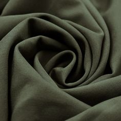 a close up view of a green fabric