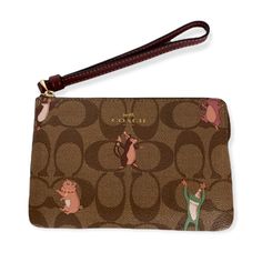 Coach Corner Zip Wristlet In Signature Coated Canvas With Party Animals Print. New With Tag. Signature Coated Canvas And Smooth Leather. Color - Brown, Khaki, Multi. Two Credit Card Slots. Zip Closure. Fabric Lining. Attached Wrist Strap. 6 1/4”L X 4”H X 1/2”D. Ships With Care From A Smoke Free Home. Brown Pouch Wristlet For On-the-go, Brown Wristlet Clutch With Card Slots, Brown Rectangular Wristlet For On-the-go, Coach Rectangular Brown Coin Purse, Brown Rectangular Coach Coin Purse, Brown Wristlet With Removable Pouch As Gift, Coach Brown Coin Purse For Travel, Coach Brown Bag For Gift, Coach Brown Bag As Gift