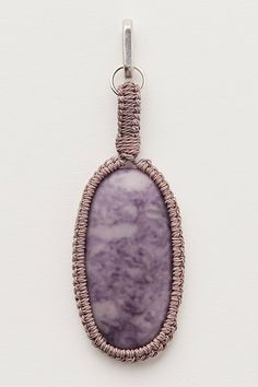 Add the most unique touch to your accessories collection with this head-turning bag charm featured in an oversized, oval stone silhouette with crochet wrapping outside for the coolest finish. | Wrapped Stone Bag Charm by Free People in Purple Crochet Wrap, Accessories Collection, Oval Stone, Womens Jewelry Bracelets, Boho Outfits, Turning, Bag Accessories, Free People, Amethyst