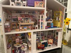 a doll house with lots of furniture and accessories