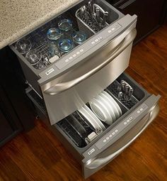 an open dishwasher drawer in a kitchen