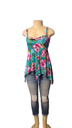 Blue Floral Babydoll Tank Top - The Fix Clothing Floral Print Stretch Tops For Vacation, Turquoise Floral Print Top For Spring, Stretch Floral Print Top For Beach Season, Turquoise Floral Print Tops For Beach, Stretchy Purple Summer Top, Purple Stretch Summer Tops, Stretch Purple Summer Tops, Turquoise Floral Print Top For Summer, Turquoise Floral Print Tops For Summer