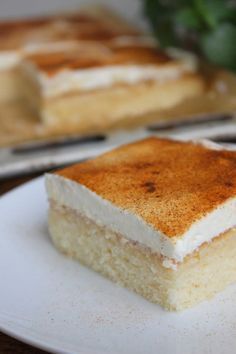 a piece of cake sitting on top of a white plate with the words applemusk kuchen vom blech