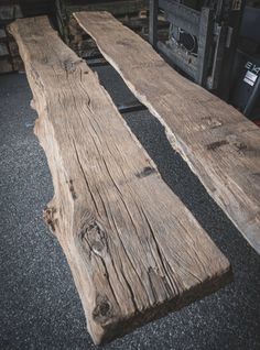 two wooden benches sitting next to each other